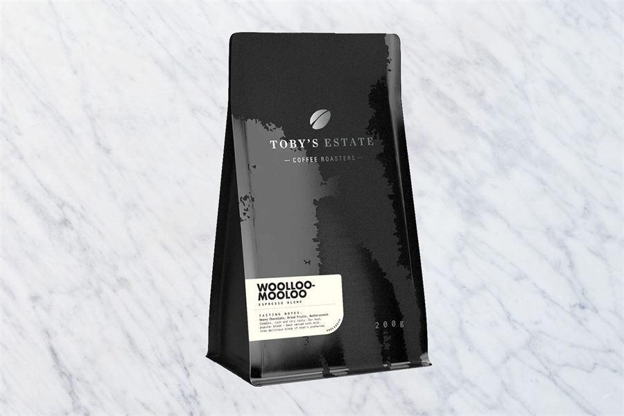 A 200g bag of Toby's Estate Woolloomooloo espresso blend on marble.
